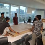 How We Safely Relocated 80 Television Sets from Bangalore to KGF – A Bulk Electronics Shifting Case Study 4 Professional packers preparing 80 TVs for safe shifting to KGF