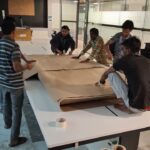 How We Safely Relocated 80 Television Sets from Bangalore to KGF – A Bulk Electronics Shifting Case Study 5 Staff boxing and labelling packed television sets for transport