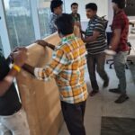 How We Safely Relocated 80 Television Sets from Bangalore to KGF – A Bulk Electronics Shifting Case Study 4 Anand Packers and Movers team wrapping office items with cushioned material