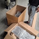 How We Safely Relocated 80 Television Sets from Bangalore to KGF – A Bulk Electronics Shifting Case Study 1 Anand Packers staff wrapping a television in shock-proof packing material in Bangalore