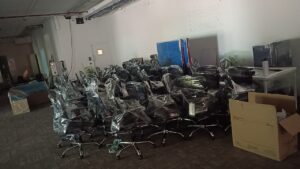 Office chairs professionally packed and stacked for DecimalMinds office relocation from Bangalore to Pondicherry